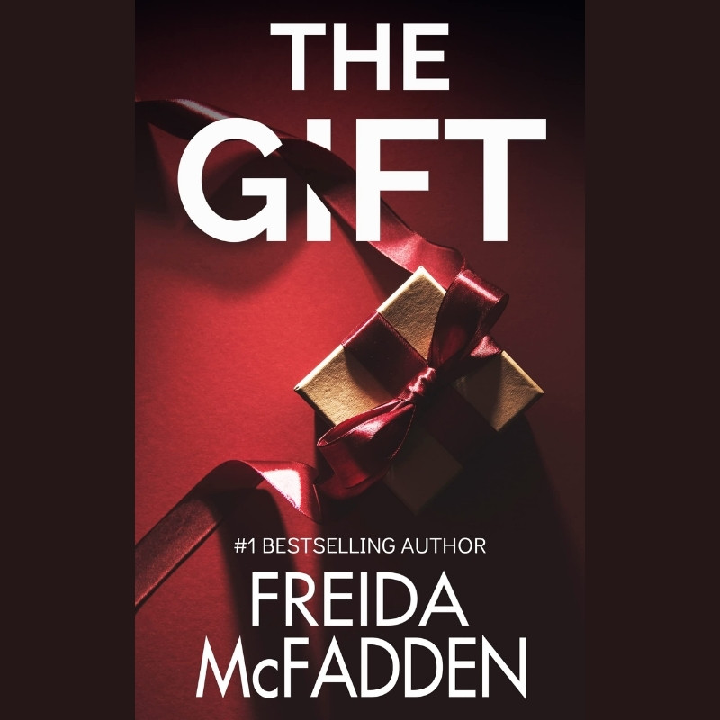 Mystery novel 'The Gift' by Freida McFadden with a golden present tied in red ribbon.